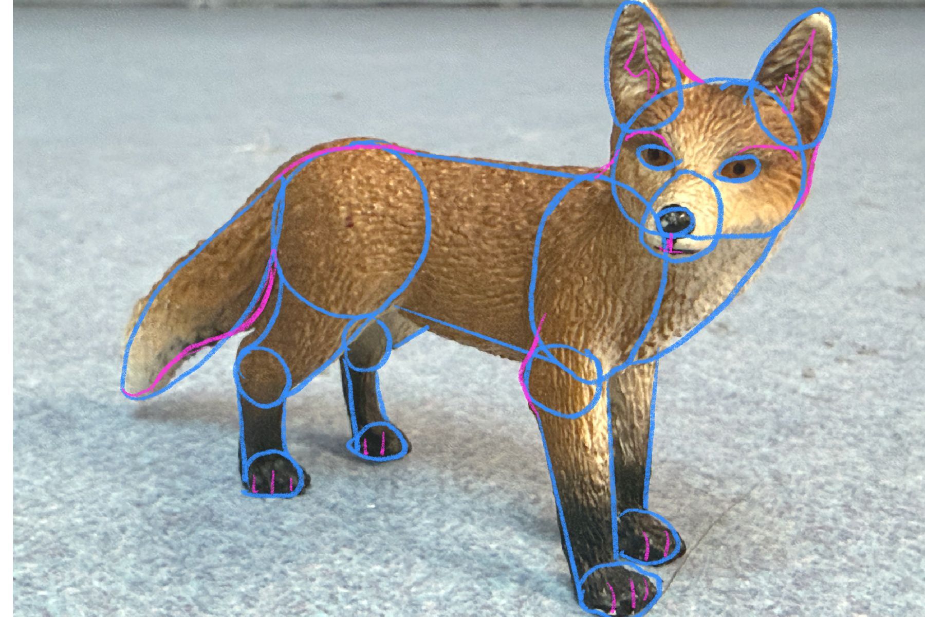 Fox figurine with blue basic shapes and pink detail lines drawn over it